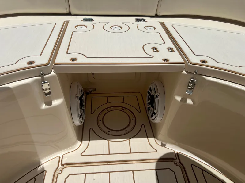 Slide: The Image of 2021 Grady-White Freedom 375 boat deck with storage compartments and speakers. - 32
