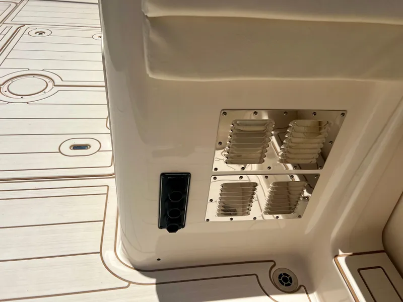 Slide: The Image of 2021 Grady-White Freedom 375 boat interior detail with ventilation grilles and deck. - 34
