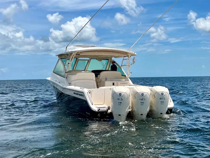 Slide: The Image of 2021 Grady-White Freedom 375 boat on open water under blue sky. - 4