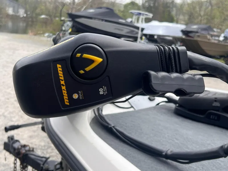 Slide: The Image of Close-up of Maxxum trolling motor on 2007 Stratos 176XT boat, parked outdoors. - 10