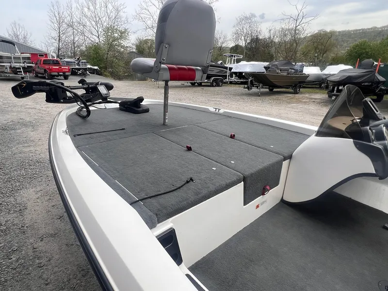 Slide: The Image of 2007 Stratos 176XT boat with fishing deck and seat, parked outdoors. - 12