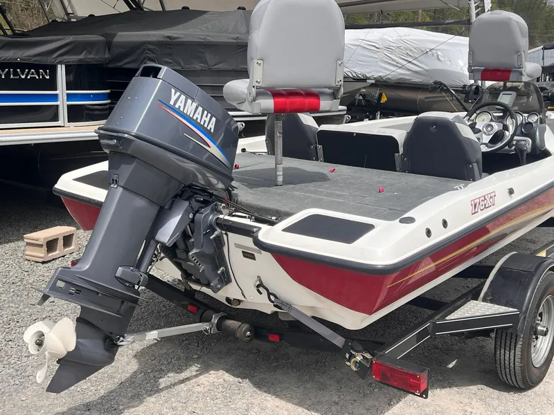 Slide: The Image of 2007 Stratos 176XT boat with Yamaha outboard motor, parked on a trailer. - 15