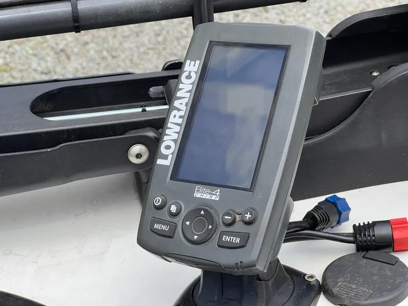 Slide: The Image of Lowrance Elite-4 fish finder on 2007 Stratos 176XT boat dashboard. - 18
