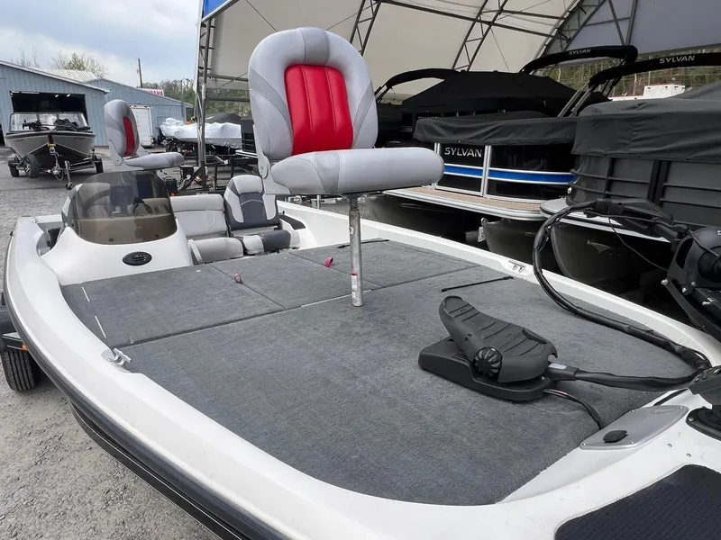 Slide: The Image of 2007 Stratos 176XT fishing boat with gray and red seating, displayed outdoors. - 24