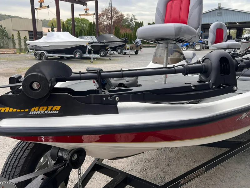 Slide: The Image of 2007 Stratos 176XT boat with Minn Kota Maxxum trolling motor, parked on a trailer. - 29