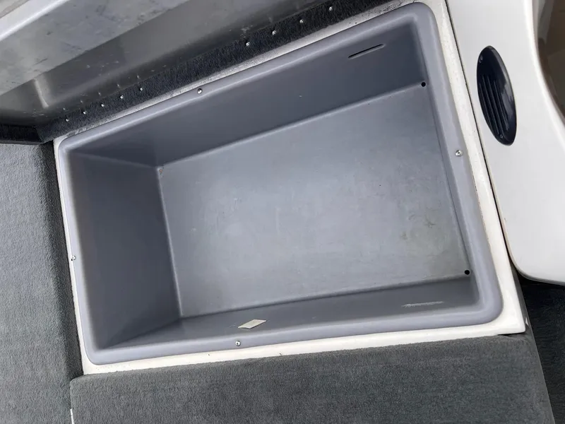 Slide: The Image of Empty storage compartment in a 2007 Stratos 176XT boat. - 30
