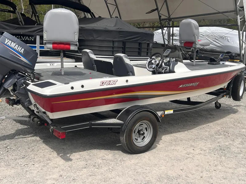 Slide: The Image of 2007 Stratos 176XT boat with Yamaha motor, parked on a trailer. - 6