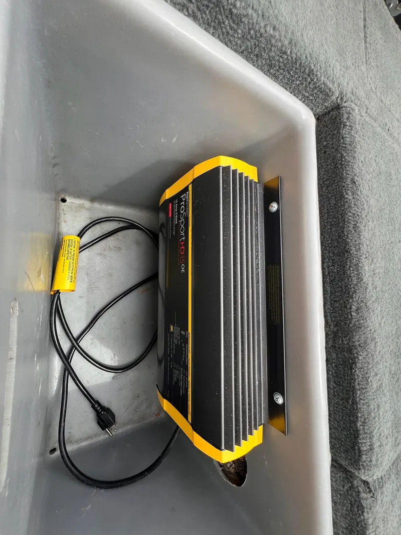 Slide: The Image of Onboard battery charger in a 2007 Stratos 176XT boat compartment. - 7