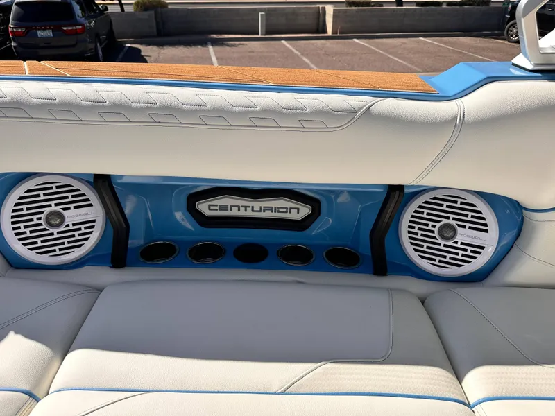 Slide: The Image of 2024 Centurion Ri265 boat interior with Roswell speakers and white leather seats. - 6