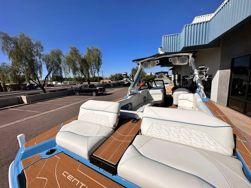 Slide: The Image of 2024 Centurion Ri265 boat with luxurious seating and modern design. - 7
