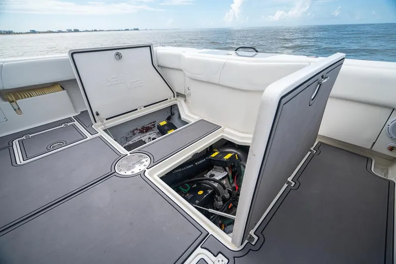 Slide: The Image of 2009 SeaVee 390I boat with open storage compartments on deck. - 10