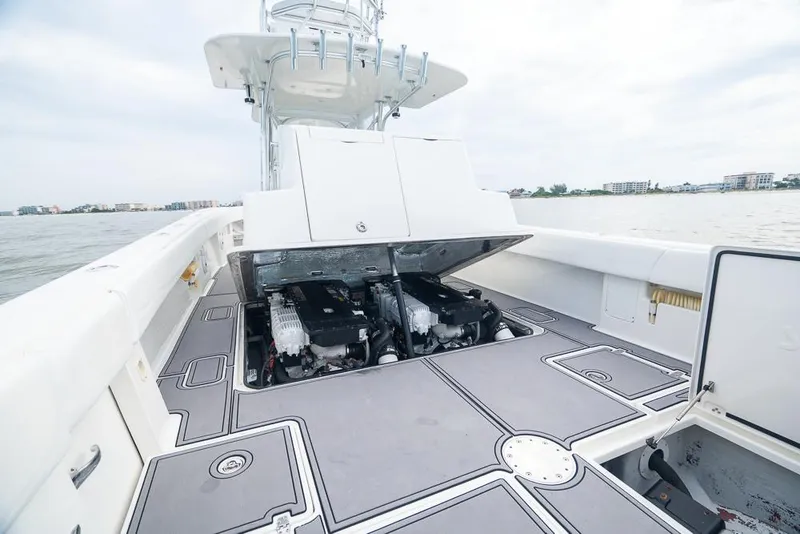 Slide: The Image of 2009 SeaVee 390I boat with open engine compartment on the water. - 12