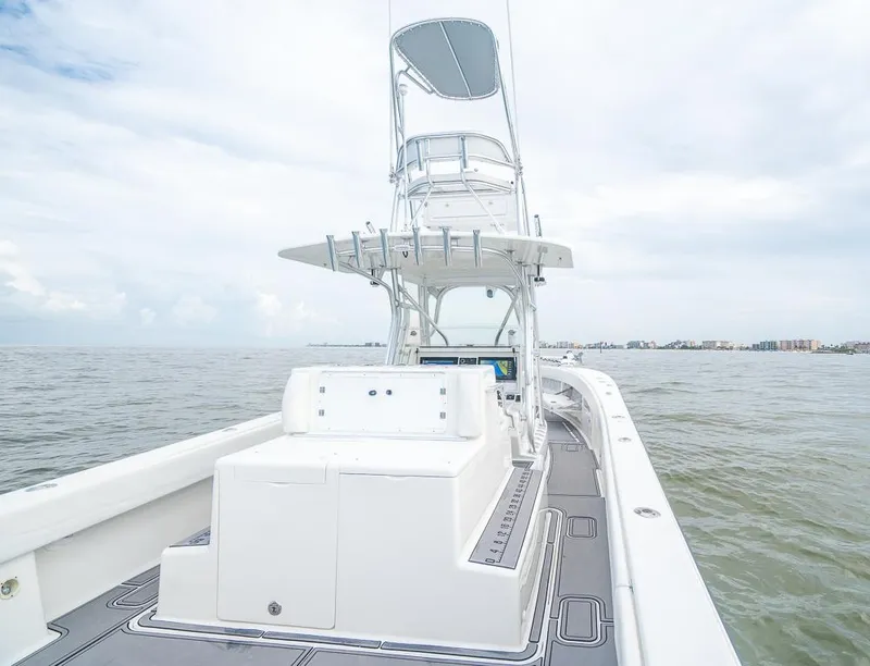 Slide: The Image of 2009 SeaVee 390I boat on open water with a clear sky. - 17