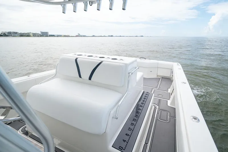 Slide: The Image of 2009 SeaVee 390I boat with white seating and ocean view. - 20