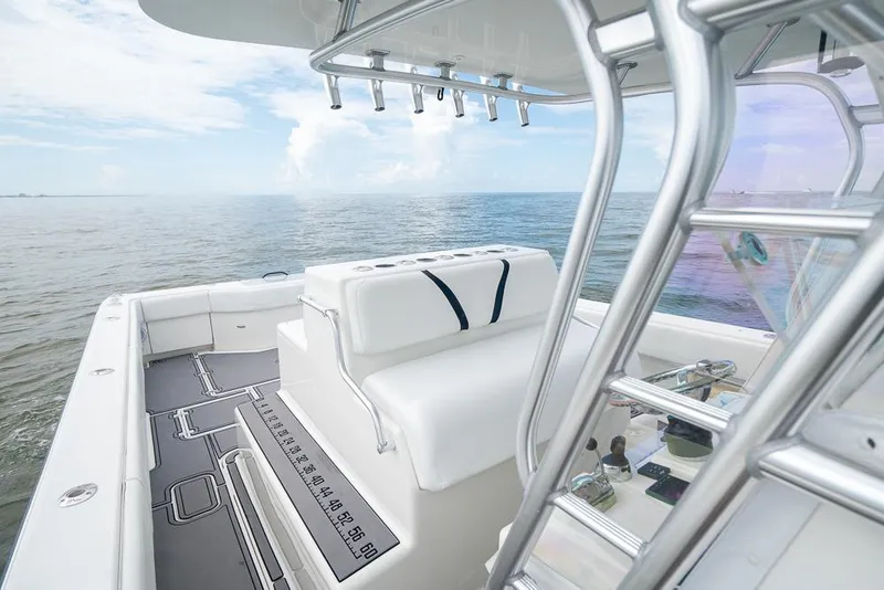 Slide: The Image of 2009 SeaVee 390I boat interior with white seating and ocean view. - 21