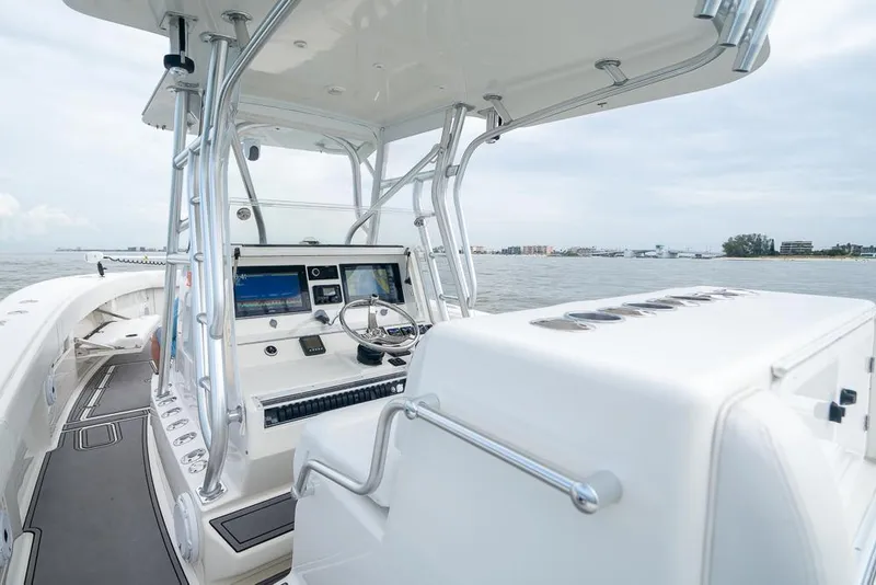 Slide: The Image of 2009 SeaVee 390I boat helm station with modern navigation equipment. - 23