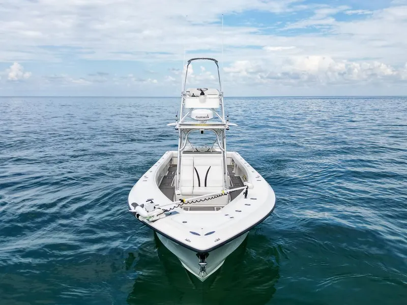 Slide: The Image of 2009 SeaVee 390I boat on calm ocean waters under a partly cloudy sky. - 3