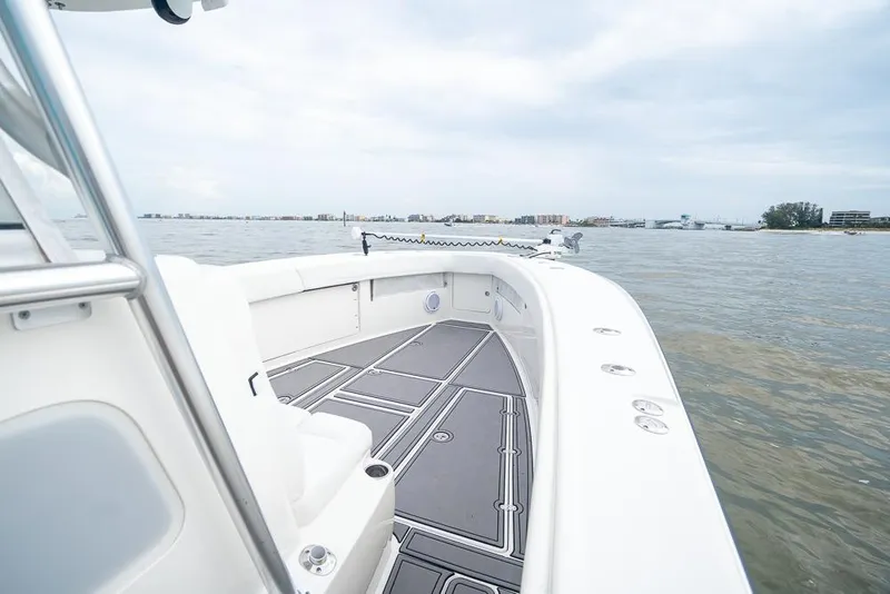 Slide: The Image of 2009 SeaVee 390I boat on calm waters with spacious deck. - 31