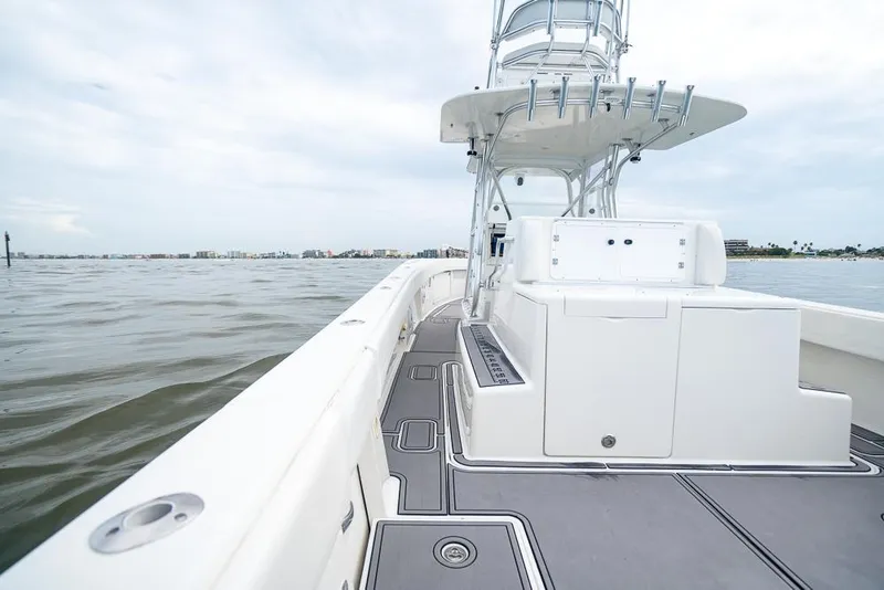Slide: The Image of 2009 SeaVee 390I boat deck with tower on calm waters. - 33