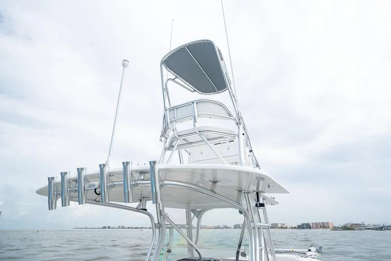 Slide: The Image of 2009 SeaVee 390I boat tower with rod holders on a calm sea. - 34