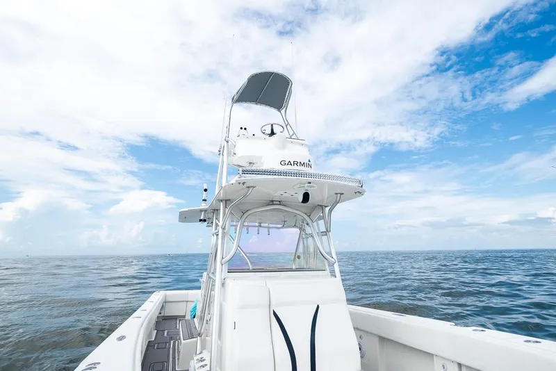 Slide: The Image of 2009 SeaVee 390I boat on open water with Garmin equipment. - 37