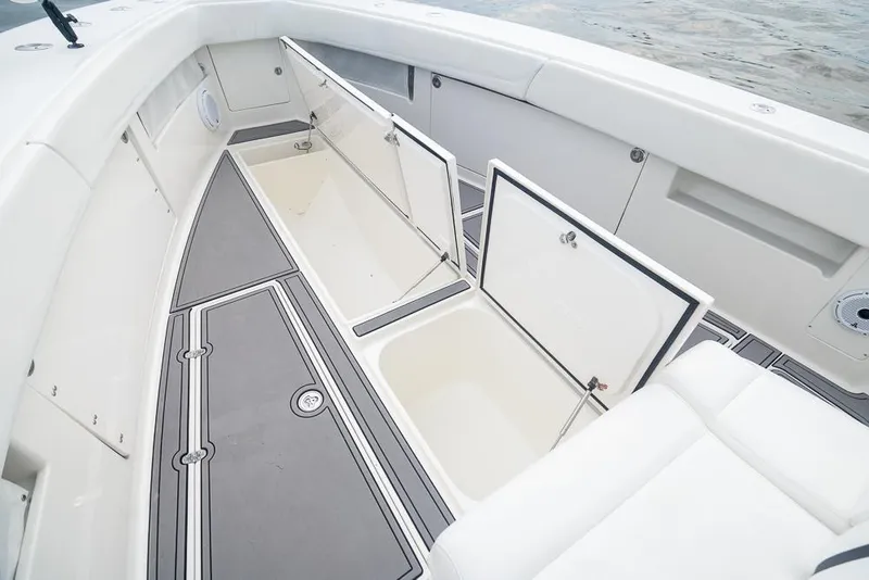Slide: The Image of 2009 SeaVee 390I boat with open storage compartments on deck. - 42