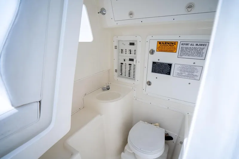 Slide: The Image of 2009 SeaVee 390I boat interior with toilet and control panel. - 46