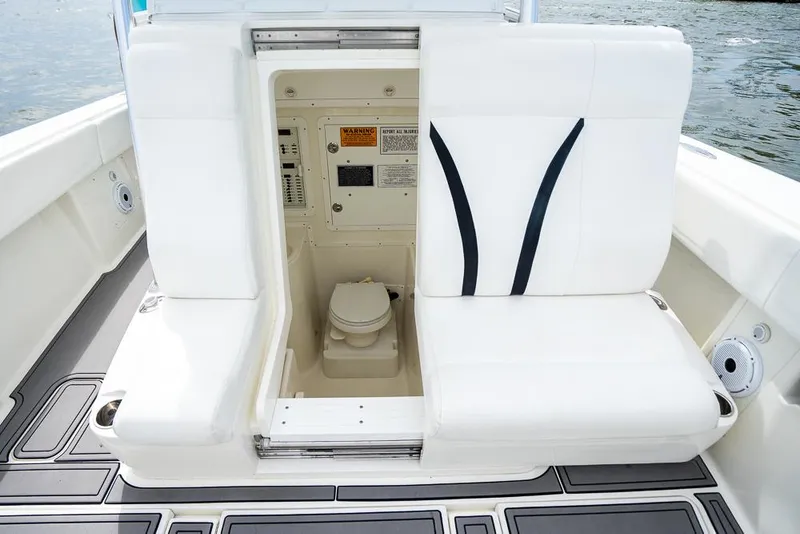 Slide: The Image of 2009 SeaVee 390I boat with open compartment revealing a marine toilet. - 47