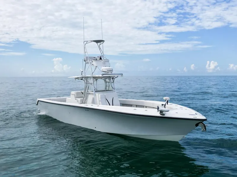 Slide: The Image of 2009 SeaVee 390I boat on calm ocean waters under a partly cloudy sky. - 9