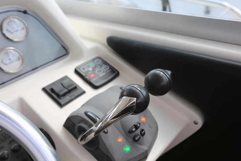 Slide: The Image of Control panel of a 2005 Wellcraft 330 Coastal boat with throttle and gauges. - 12