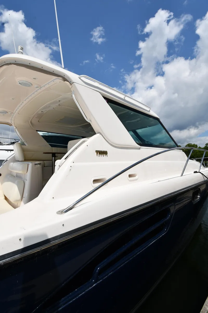 Slide: The Image of 2007 Tiara Yachts 4700 Sovran luxury boat docked under a blue sky. - 1