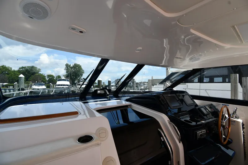 Slide: The Image of Interior helm of 2007 Tiara Yachts 4700 Sovran with marina view. - 11