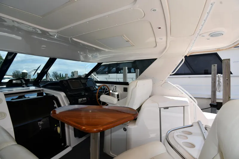 Slide: The Image of Interior of 2007 Tiara Yachts 4700 Sovran with helm and seating area. - 27