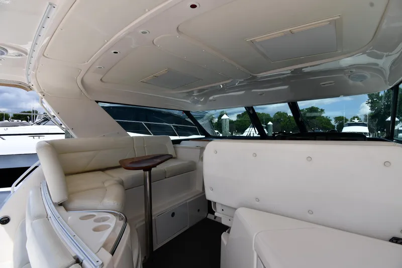 Slide: The Image of Interior of 2007 Tiara Yachts 4700 Sovran with white seating and table. - 29