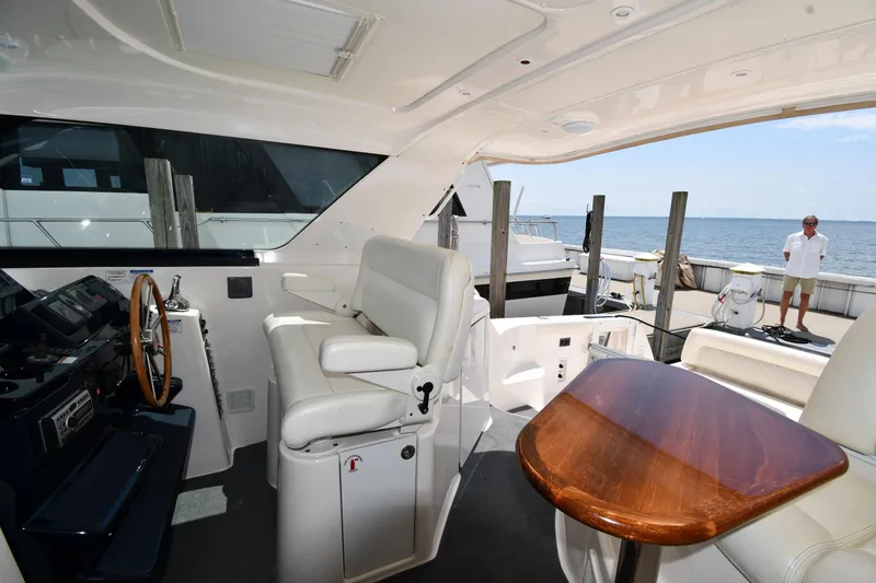 Slide: The Image of 2007 Tiara Yachts 4700 Sovran cockpit with helm station and seating. - 32
