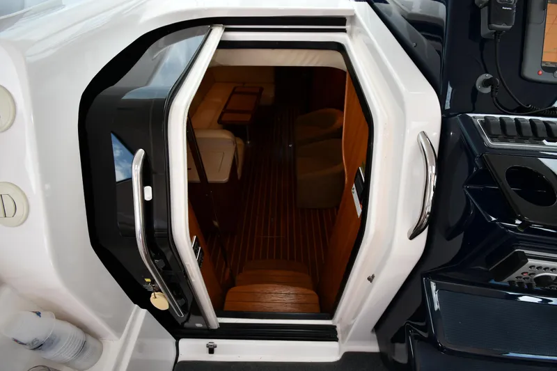 Slide: The Image of 2007 Tiara Yachts 4700 Sovran cabin entrance with wooden interior. - 36
