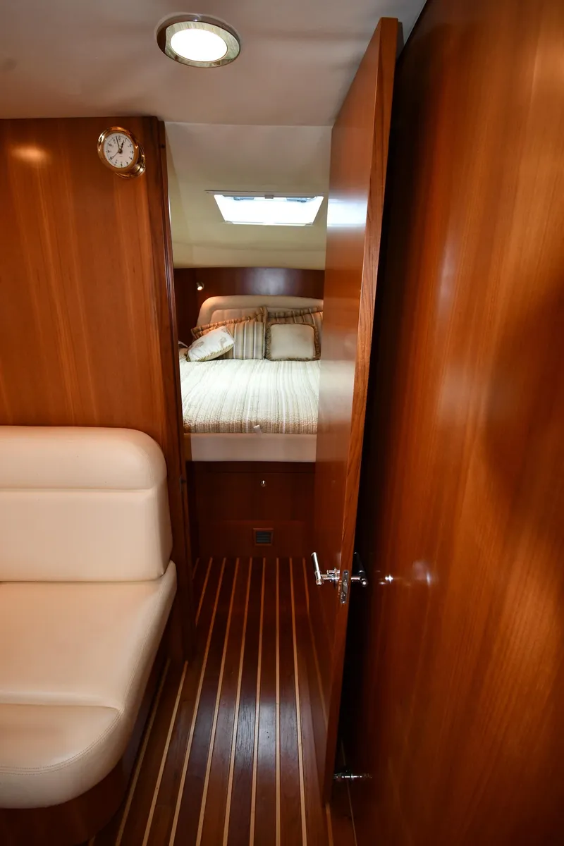 Slide: The Image of 2007 Tiara Yachts 4700 Sovran cabin interior with bed and seating area. - 37