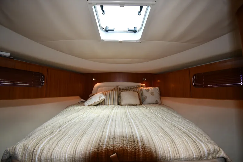 Slide: The Image of 2007 Tiara Yachts 4700 Sovran cabin with bed and skylight. - 38