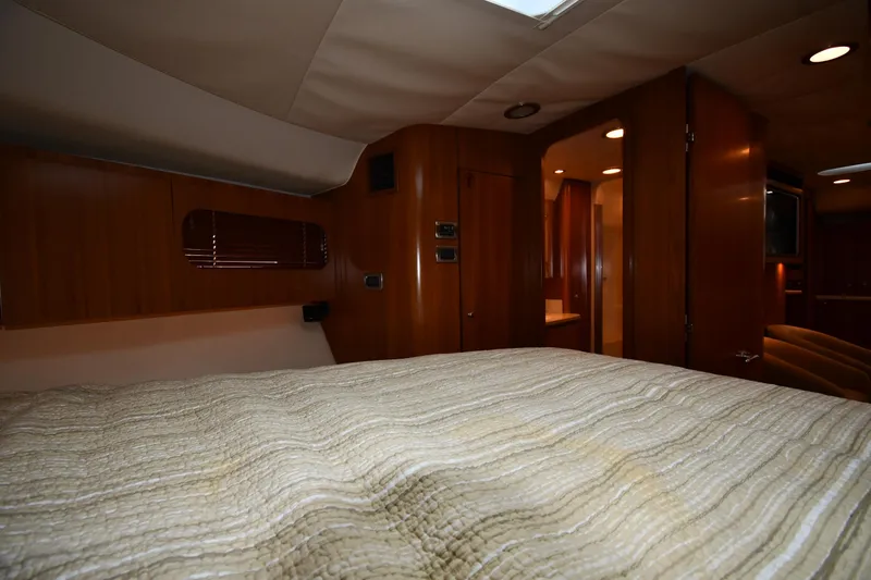 Slide: The Image of Interior cabin of a 2007 Tiara Yachts 4700 Sovran with wood paneling and bed. - 42