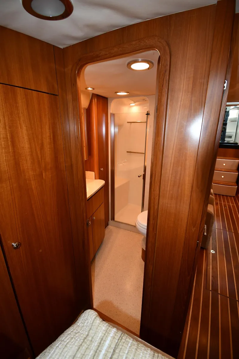 Slide: The Image of 2007 Tiara Yachts 4700 Sovran bathroom with wooden cabinetry and modern fixtures. - 43