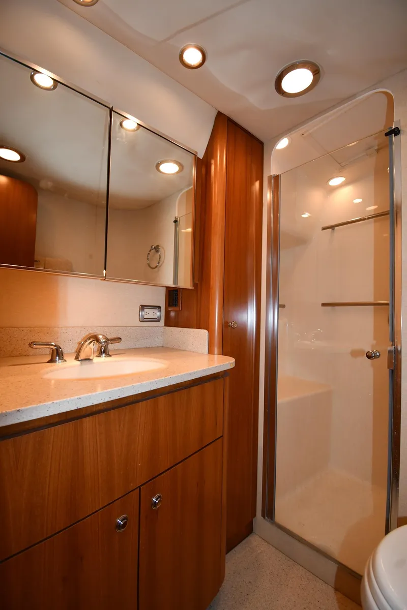 Slide: The Image of Luxurious bathroom in 2007 Tiara Yachts 4700 Sovran with modern fixtures and wooden cabinetry. - 44