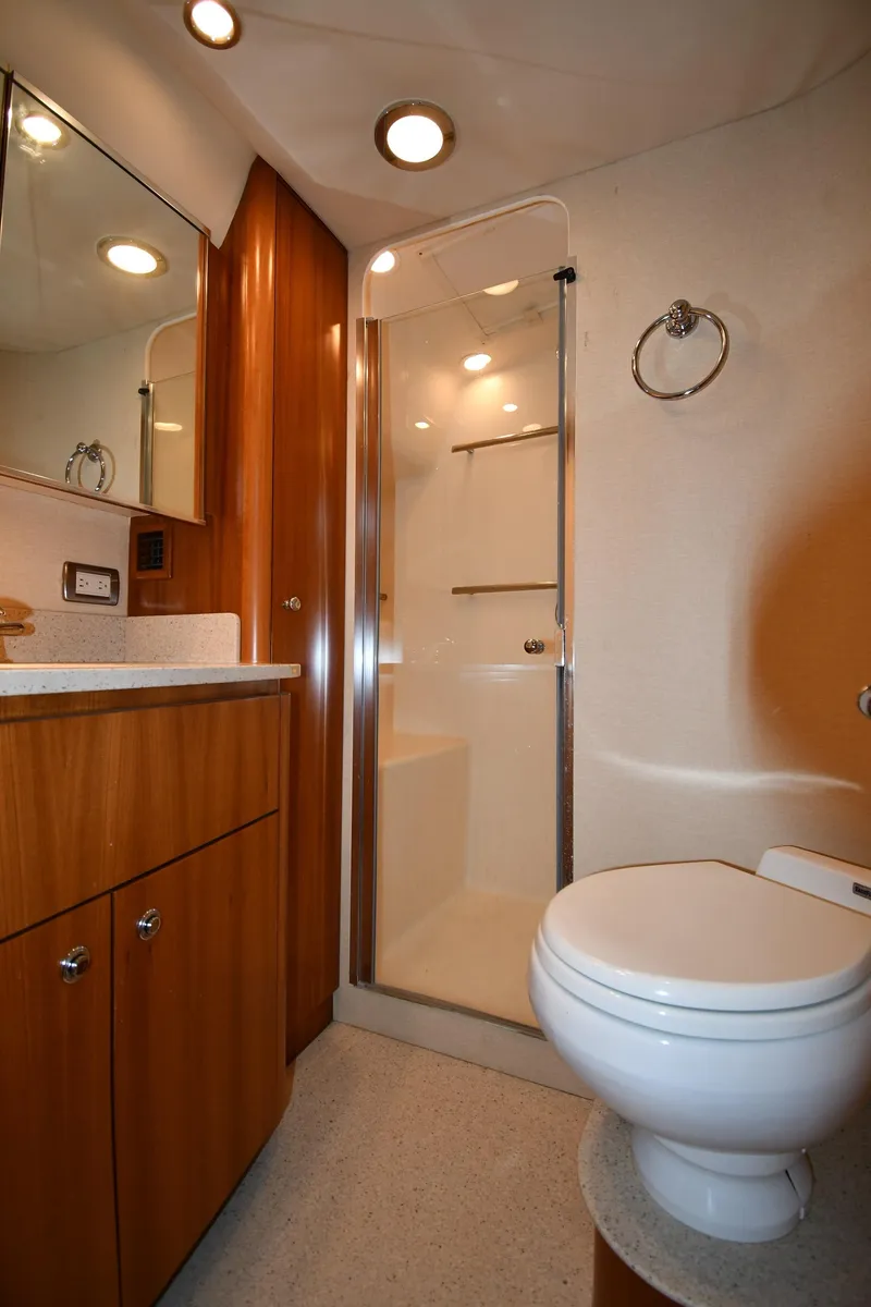 Slide: The Image of 2007 Tiara Yachts 4700 Sovran bathroom with shower, vanity, and toilet. - 45
