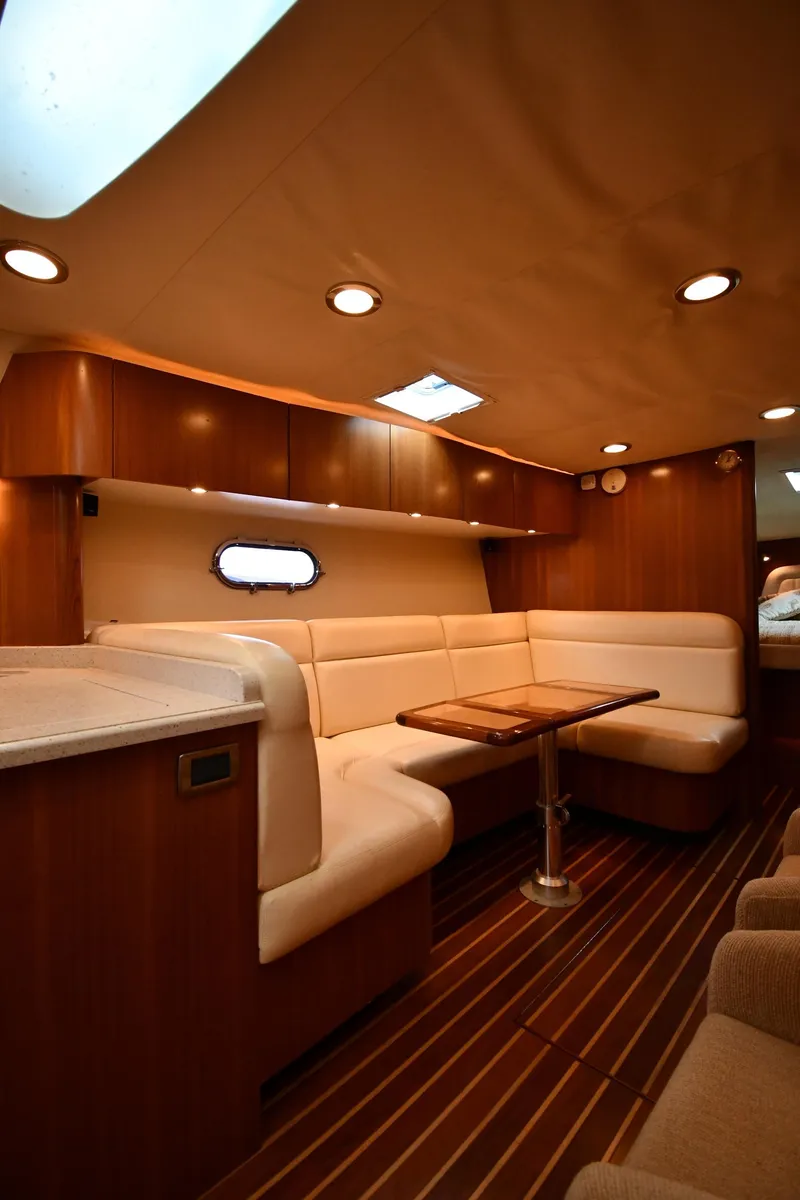 Slide: The Image of 2007 Tiara Yachts 4700 Sovran interior with elegant seating and wooden finishes. - 49