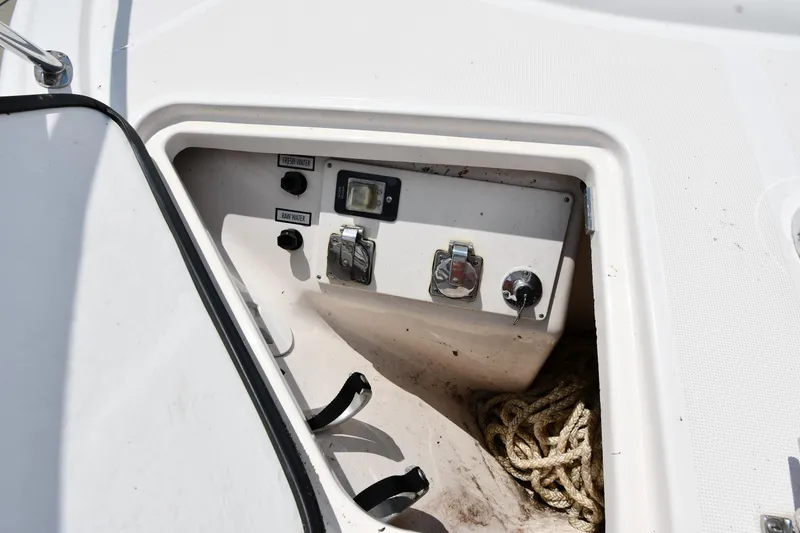 Slide: The Image of Control panel and storage compartment on a 2007 Tiara Yachts 4700 Sovran. - 6
