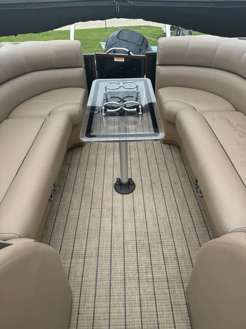 Slide: The Image of 2021 Veranda VTX25RC boat interior with beige seating and a central table. - 11