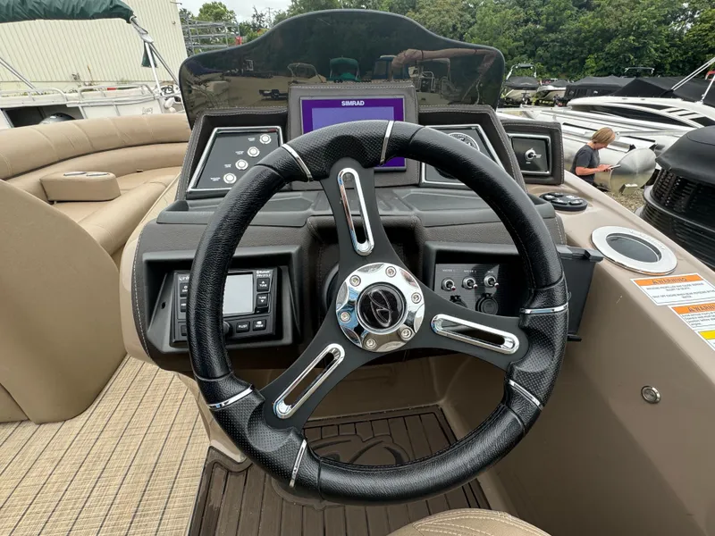 Slide: The Image of 2021 Veranda VTX25RC boat steering wheel and dashboard. - 6