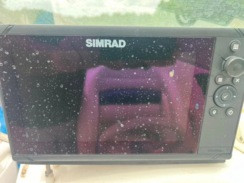 Slide: The Image of Simrad navigation system on a 2001 Wellcraft 260 Excalibur Sport boat. - 4