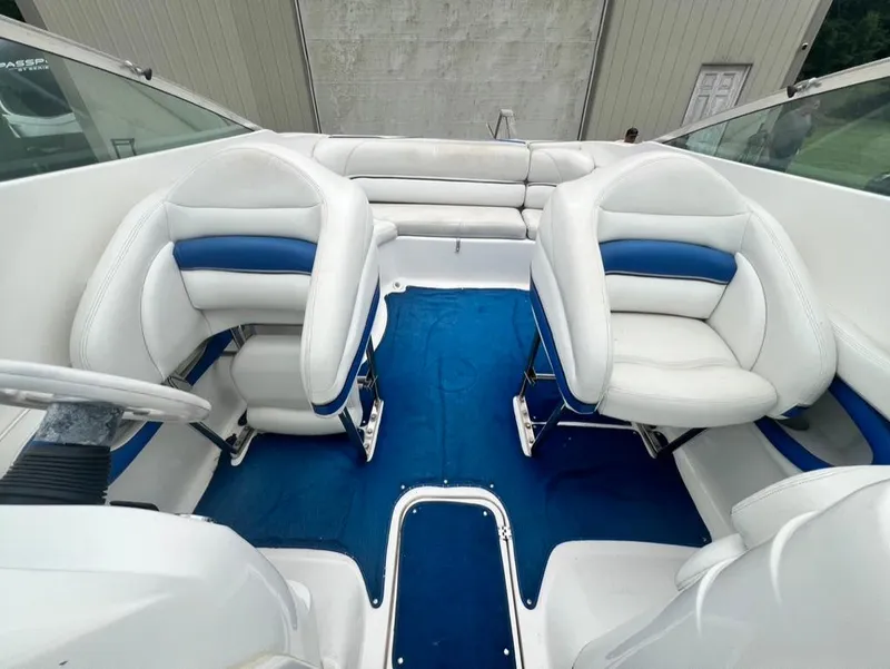 Slide: The Image of 2001 Wellcraft 260 Excalibur Sport boat interior with white and blue seating. - 5