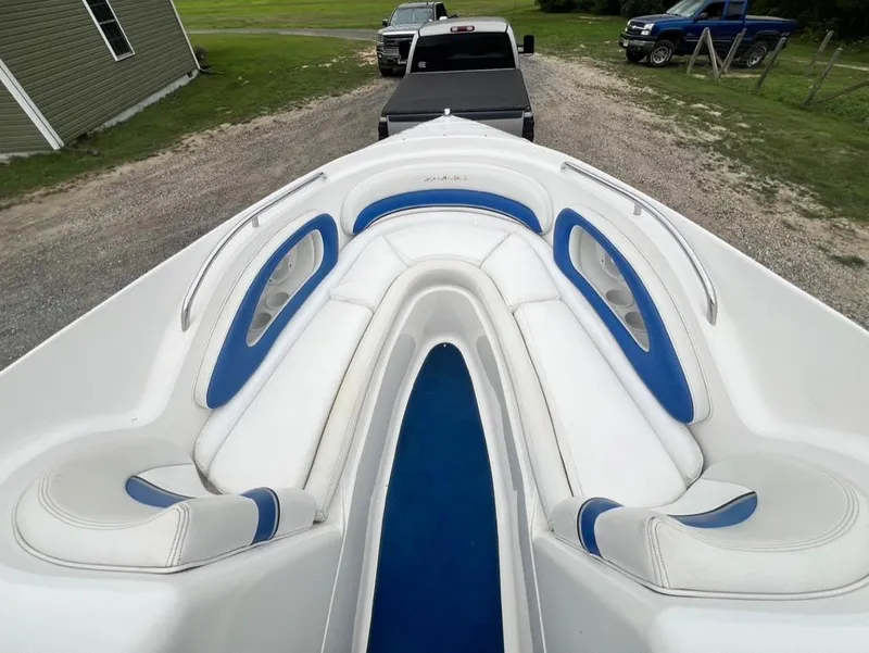Slide: The Image of 2001 Wellcraft 260 Excalibur Sport boat interior with white and blue seating. - 7