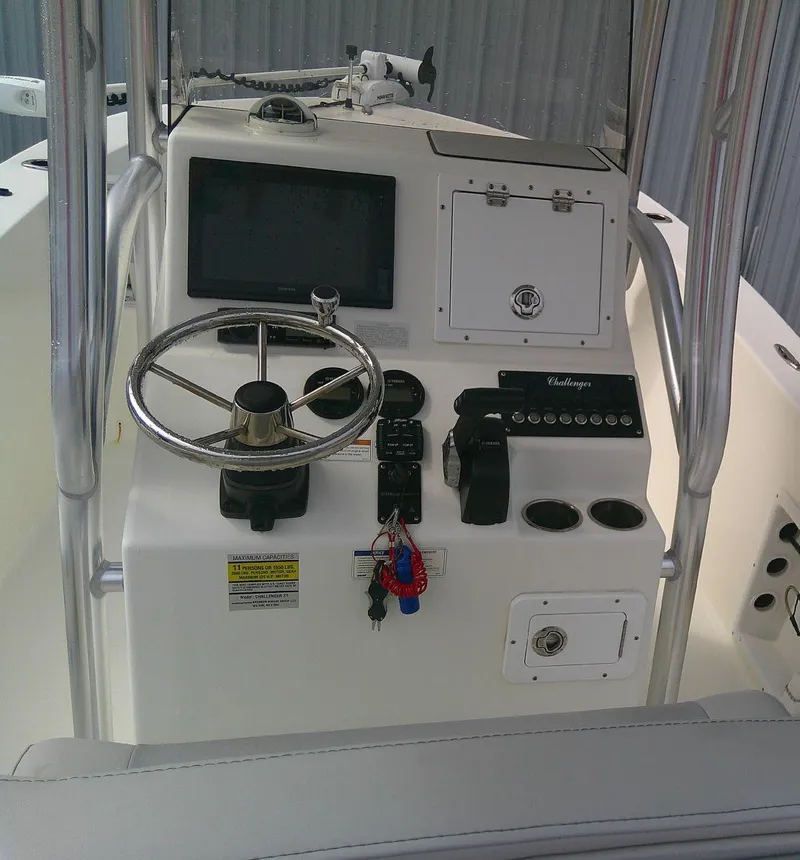 Slide: The Image of KenCraft Challenger 21 boat console, 2020 model, featuring steering wheel and control panel. - 10